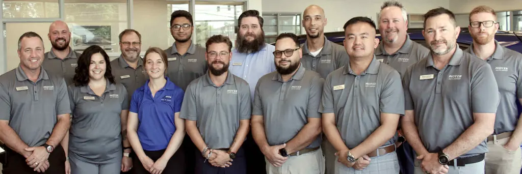 Moyer Auto Group employees together in a dealership